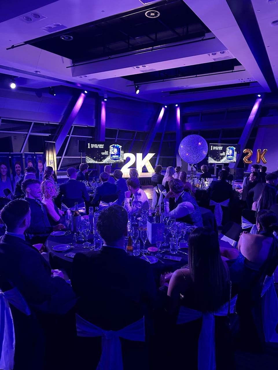 The 2K Gala ballroom lit up in purple