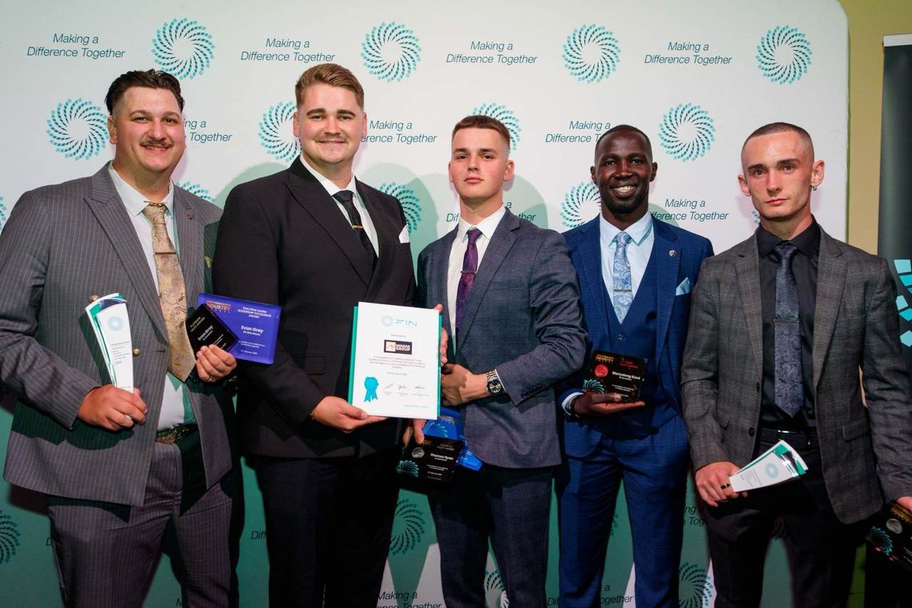 Leaders holding their awards and certificate
