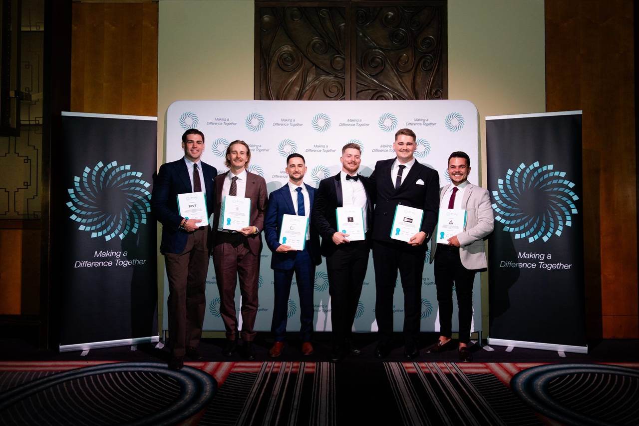 Leaders holding certificates on the red carpet