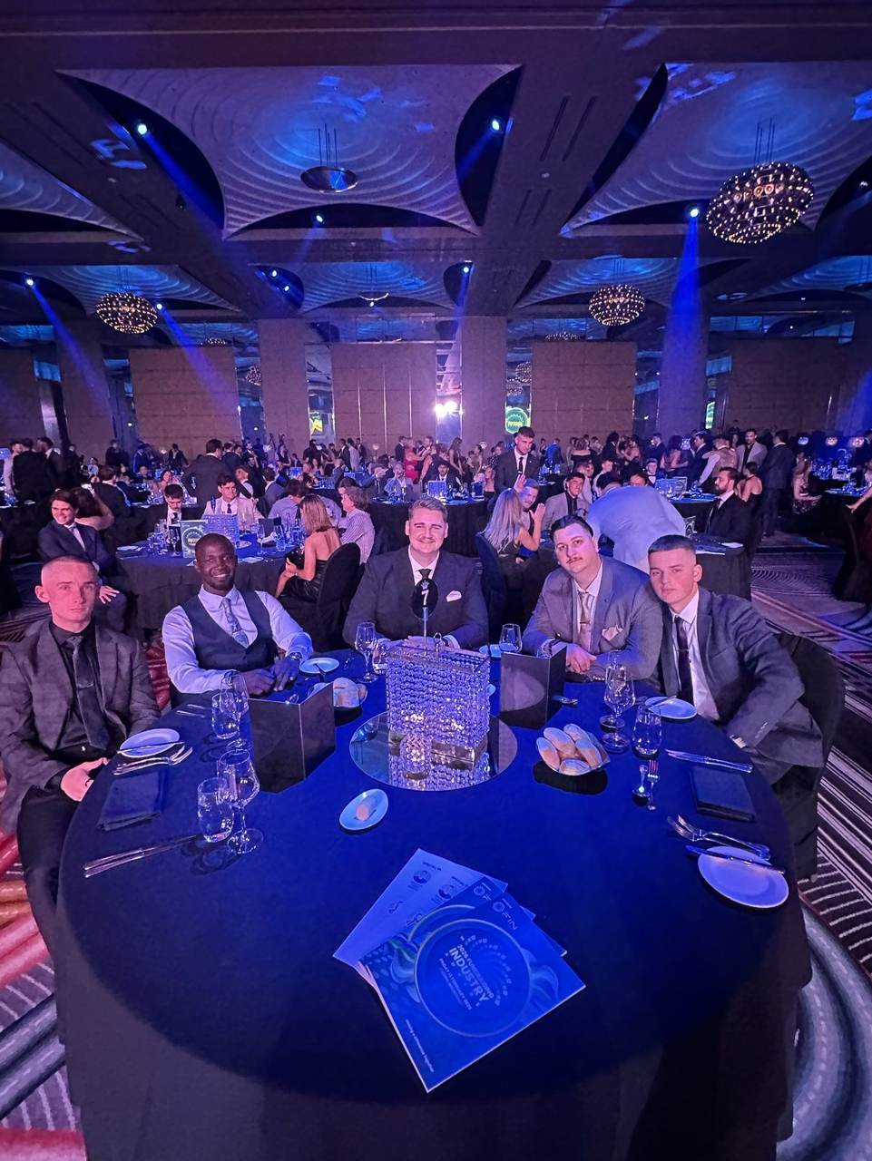 Team at their table in the gala ballroom