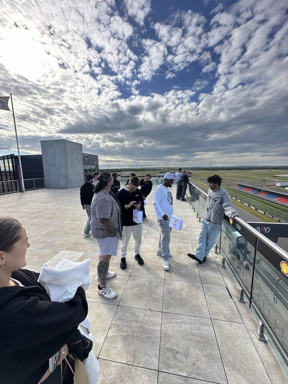 Team on the rooftop overlooking the racetrack