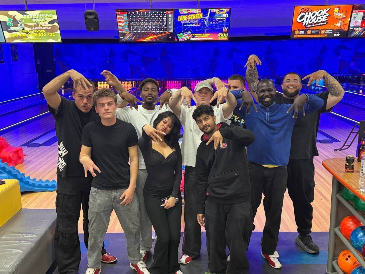Team posing together at the bowling alley