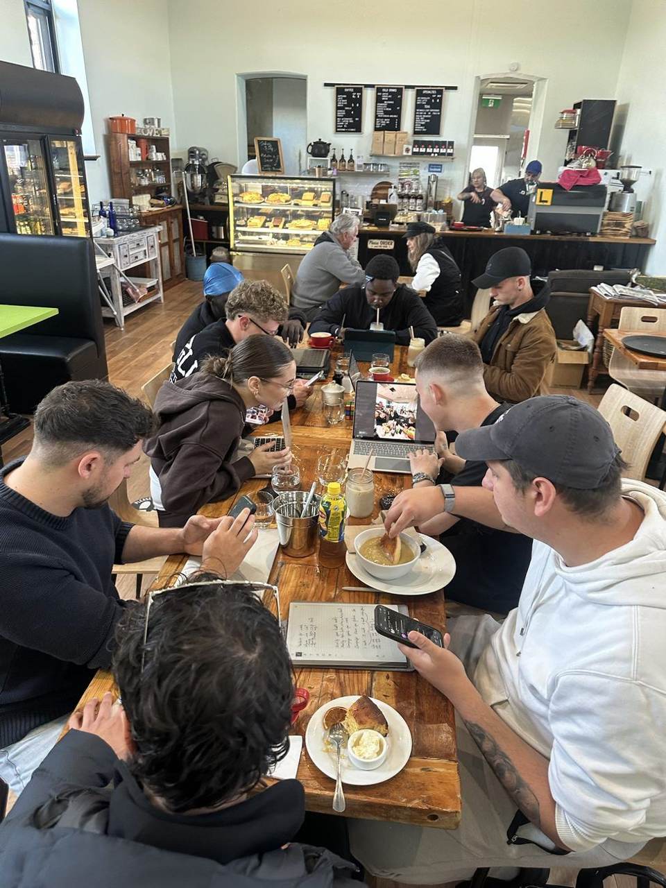 Team planning the week together at a cafe