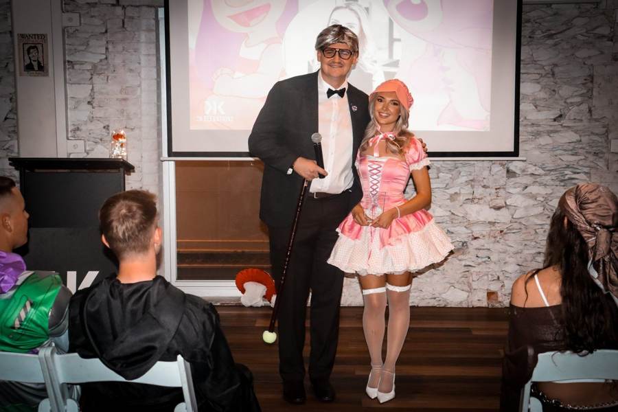 A Minear Group team member receiving her award on stage