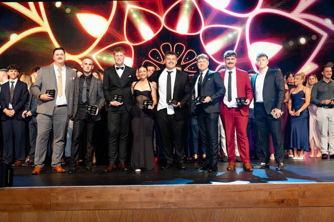 The Minear Group team on stage at the gala