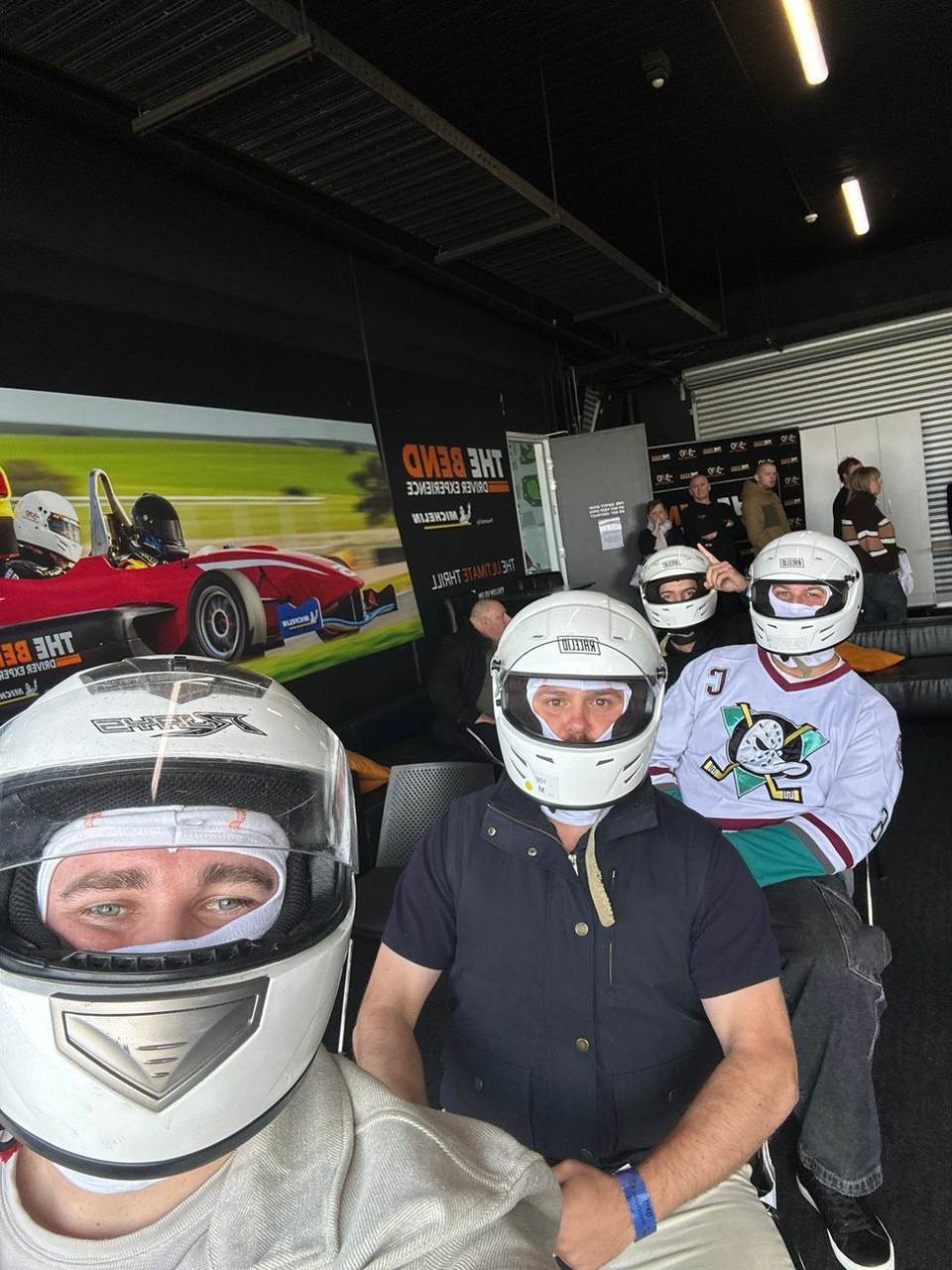 Team suited up in racing helmets at The Bend