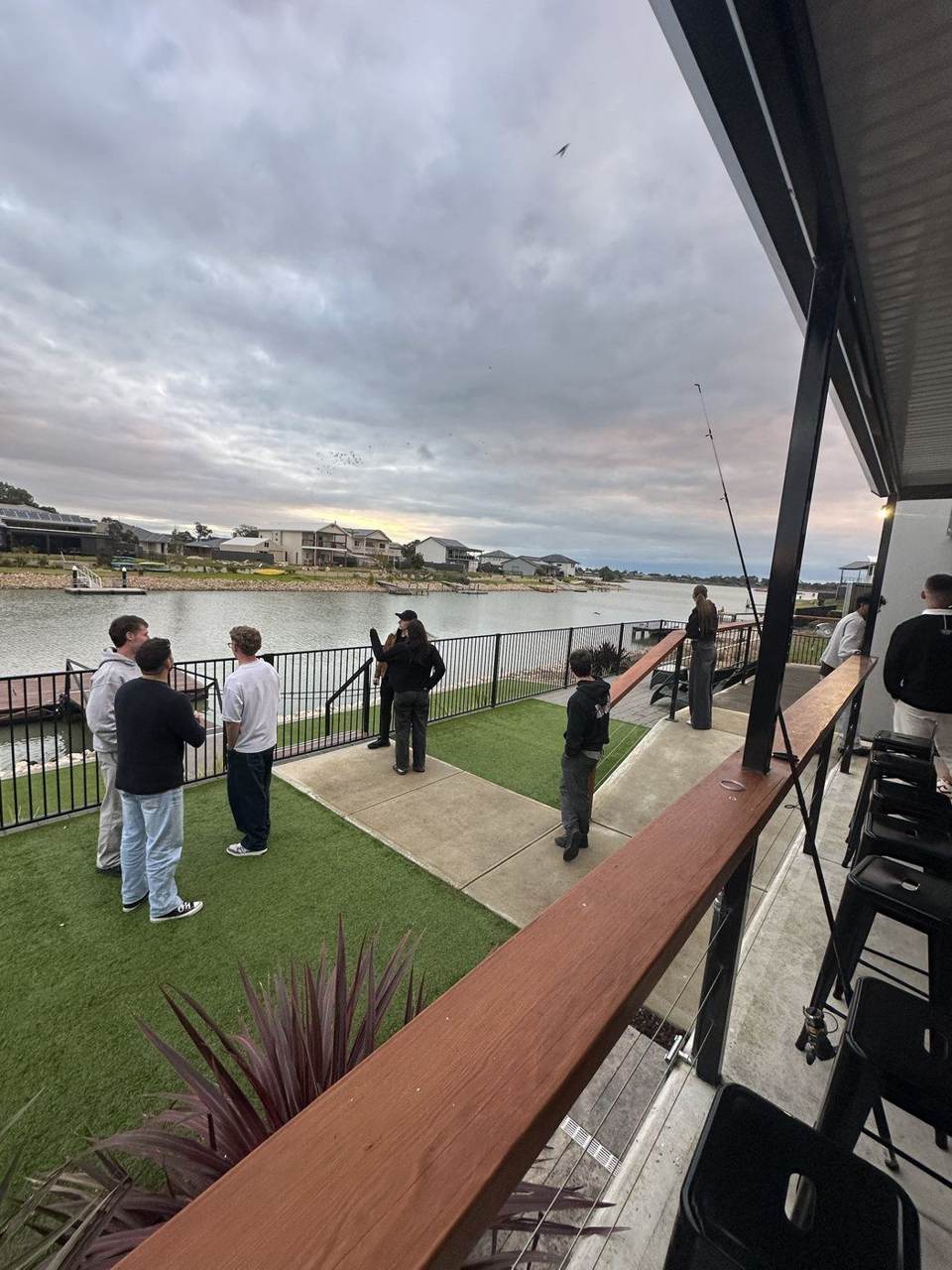 Team relaxing by the water on a road trip