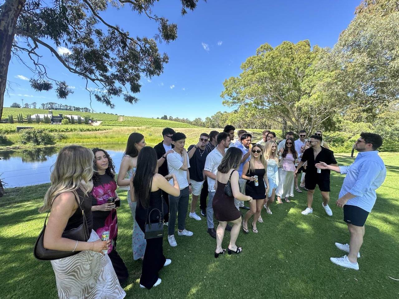 Team gathered on the lawn at a winery